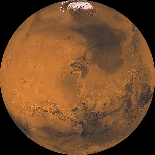 Reddish Mars with the Valles Marineris canyon across it, in a mosaic from the Viking orbiters