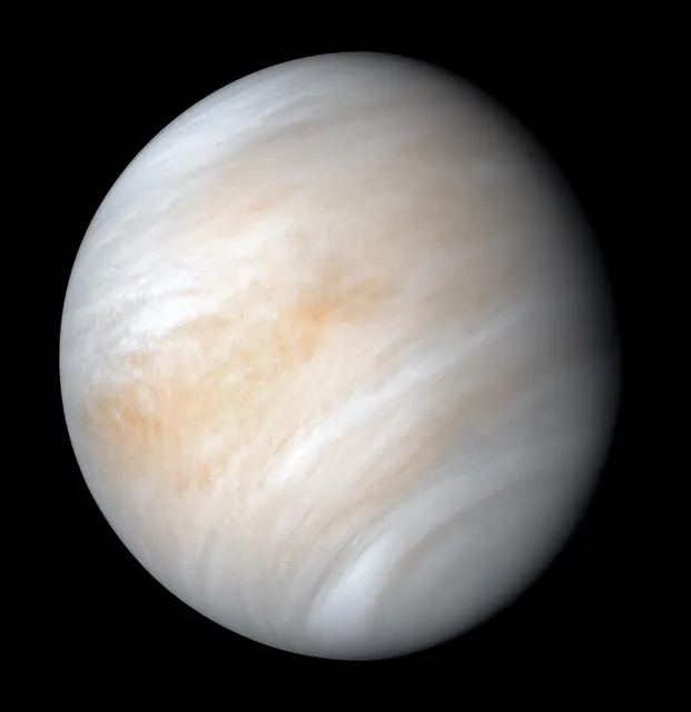 Venus in near-true colour, covered in pale clouds, in a reprocessed photo from the Mariner 10 probe